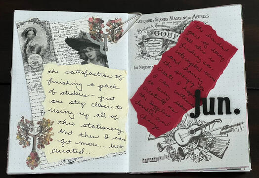 collage journal spread with red and cream journaling blocks surrounded by black and white stickers and jun. in black foam letters